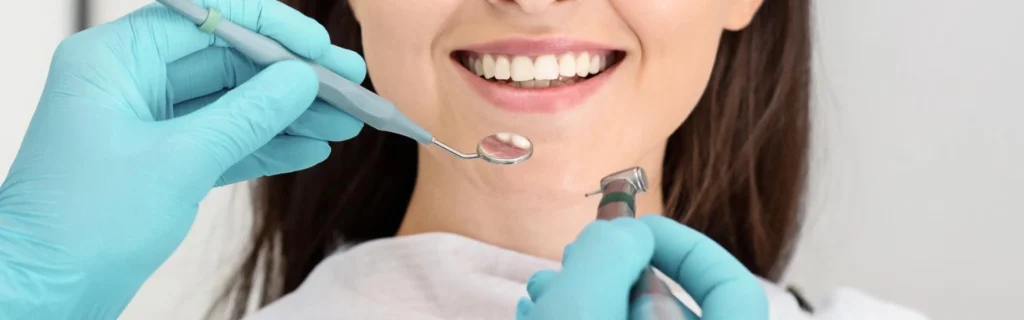 Patient smiling during a restorative dental check-up session