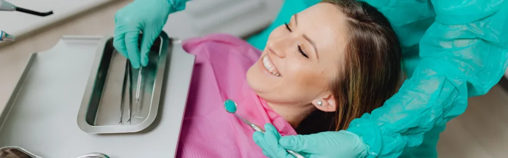 Women smiling during a dental checkup